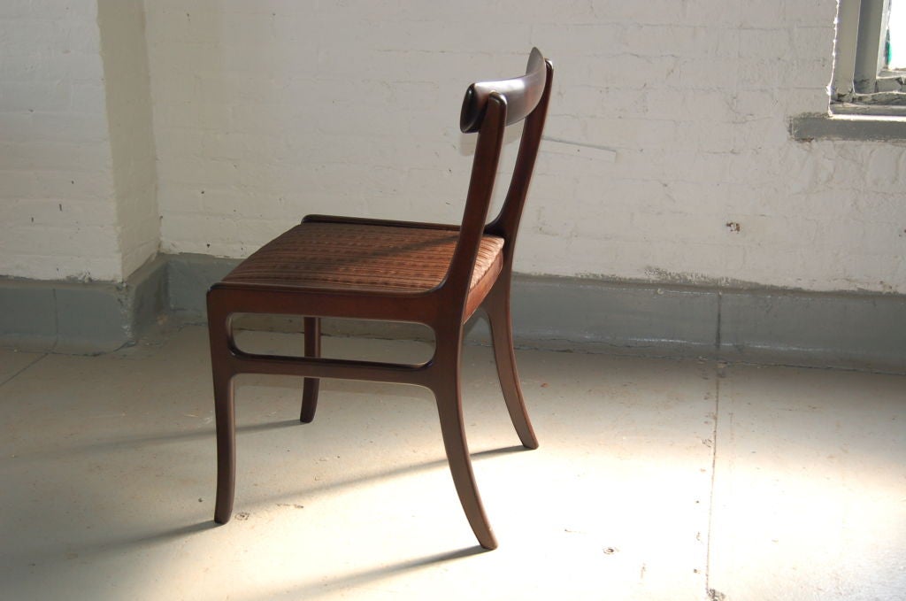 6 side and 2 arm chairs in mahogany by Danish Cabinetmaker Ole Wanscher.