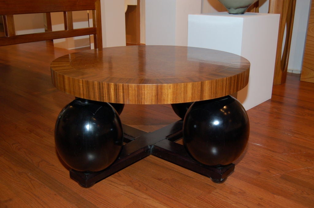 Amboyna burl and zebra wood top on black lacquered base with four round supports for Swedish furniture maker Mjolby