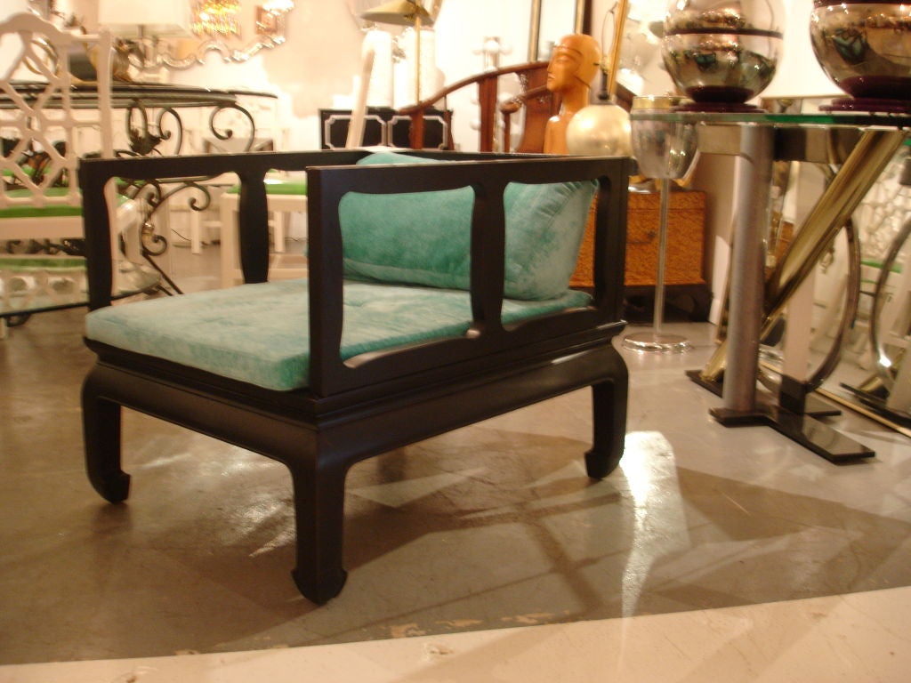 A beautifully designed pair of ebonized asian modern chairs.These chairs have a James Mont look to them.