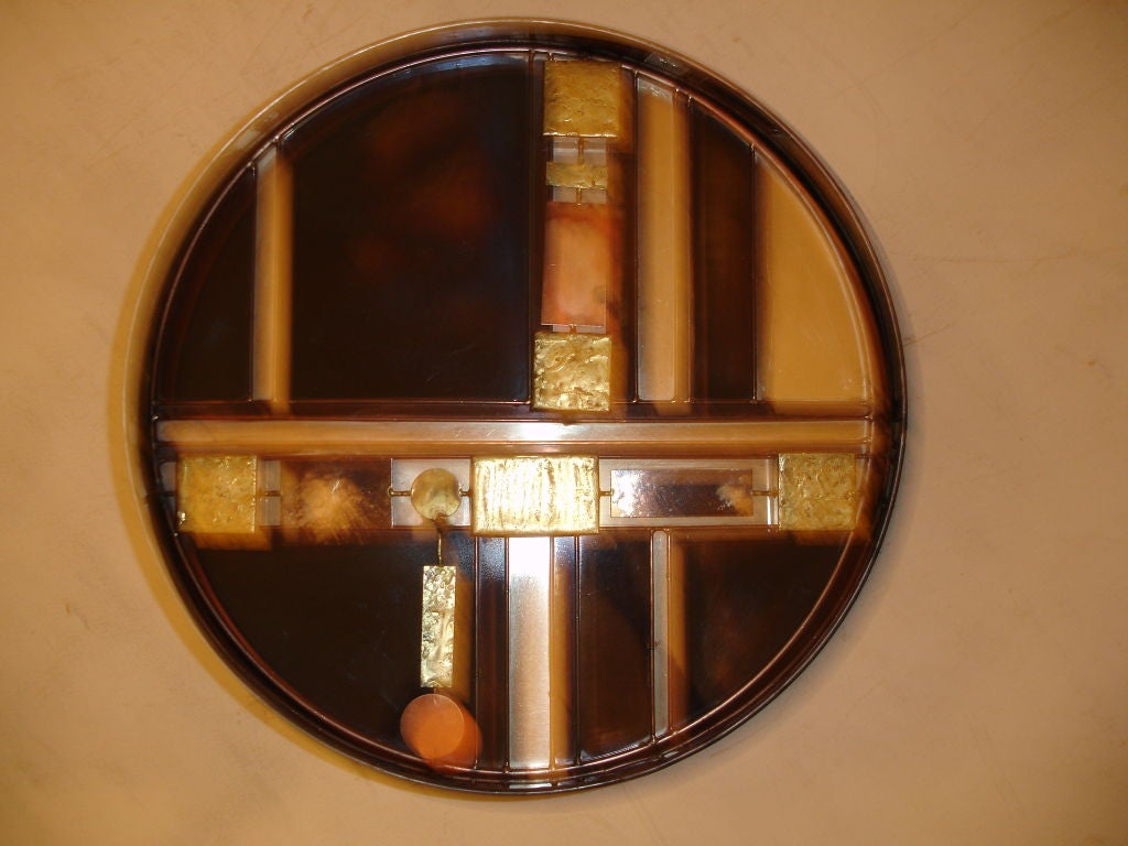 A rare and unusual mixed metal drum table by Curtis Jere. Glass is missing.Piece is signed