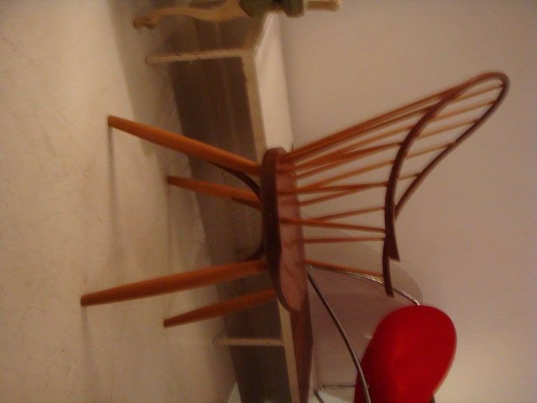 A traditionally style chair handcrafted of mixed woods by Thomas Moser.