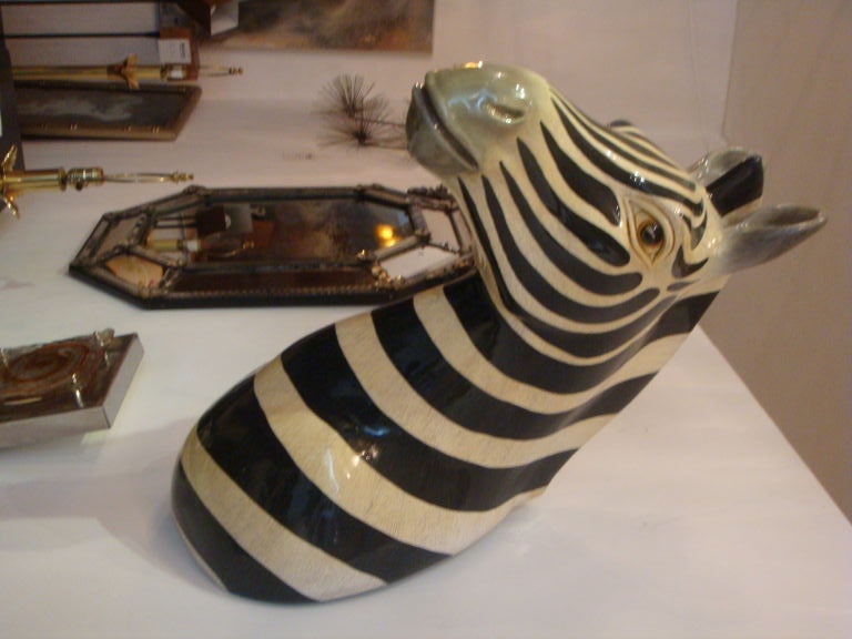 A papier mache bust of a Zebra by Sergio Bustamante. Piece is artist signed and numbered.