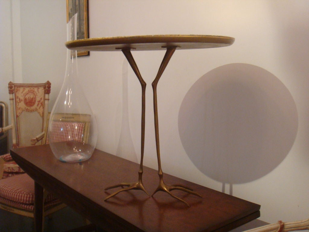 A brass and gold gilded Traccia table by Meret Oppenheimer. This is a second edition table. Top has ware.