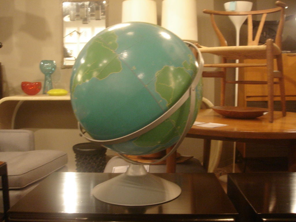 Military globe by Nystrom.  USA, circa 1950.  Features bold green continents on blue ocean, mounted on a metal base with swivel mechanism.<br />
<br />
Item may be viewed at our showroom at Center 44, 222 East 44th Street, Second Floor, New York,