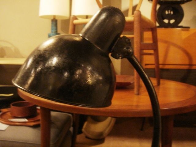Vintage black metal desk lamp designed by Christian Dell for Kaiser.  Germany, circa 1940.  

In good original condition; light vintage wear.  Newly rewired for use in the USA with black silk twist cord.