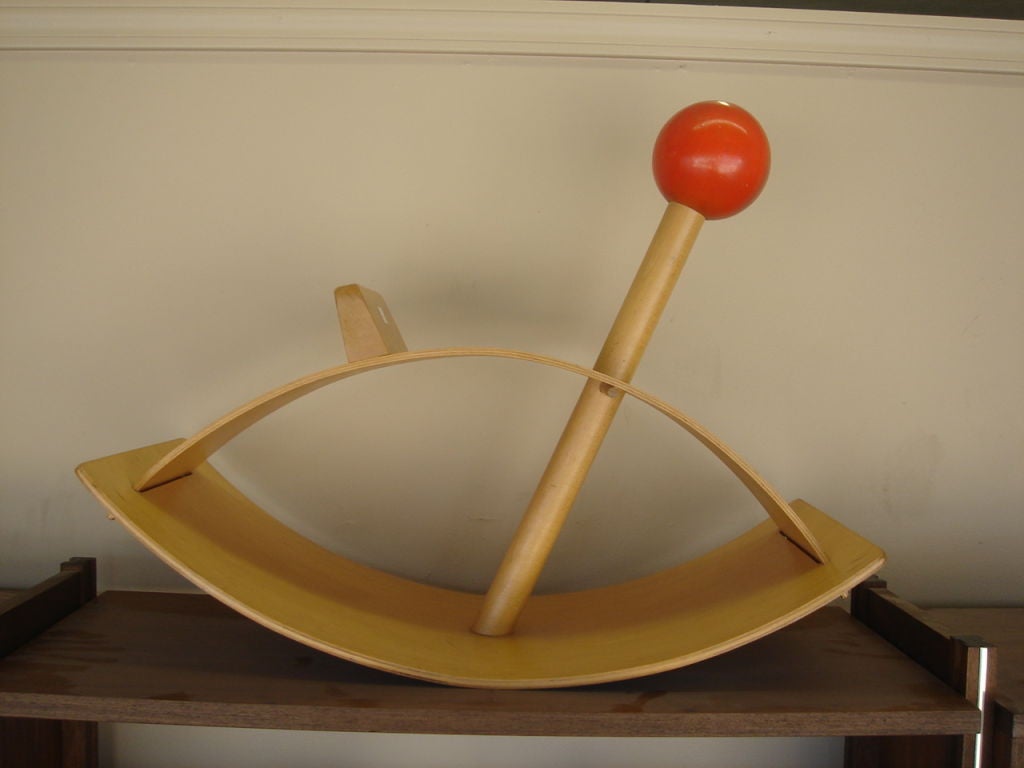 Bentwood toy rocking horse by Creative Playthings.  USA, circa 1950.  features blonde wood body with red wood ball detail.