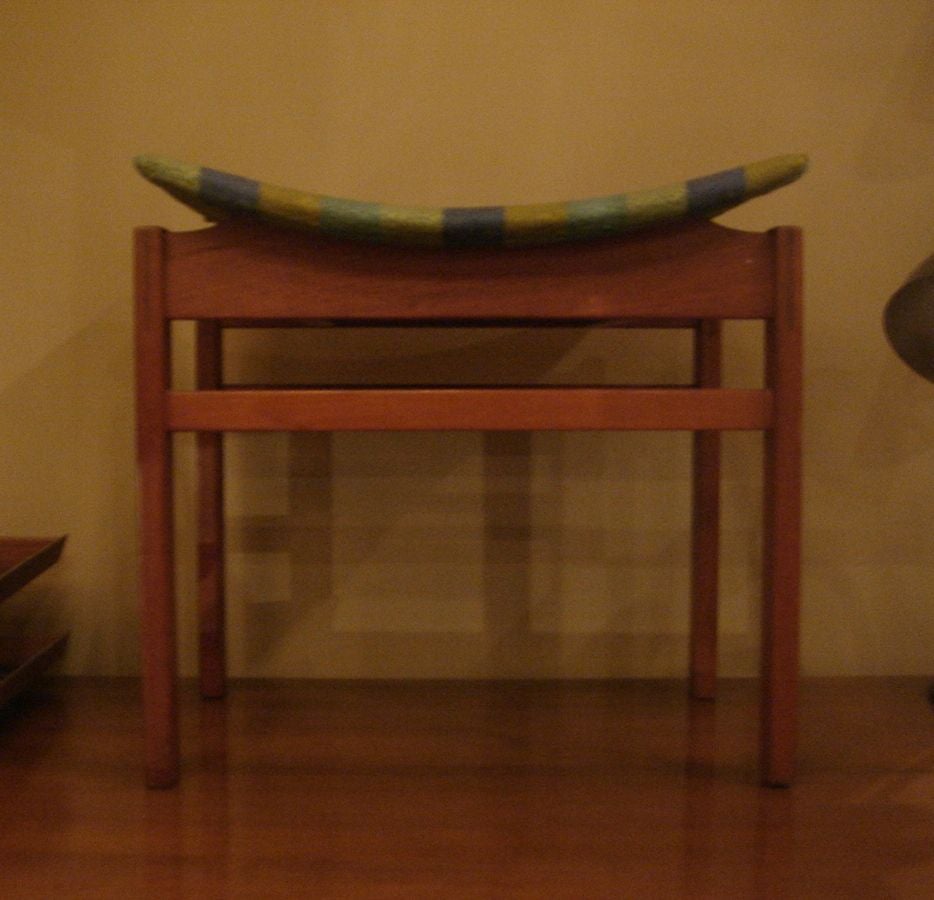 Vintage teak bench/stool by John Stuart in the style of Finn Juhl.  Made in Denmark for John Stuart, circa 1960.  <br />
<br />
Signed with John Stuart label to underside and marked 