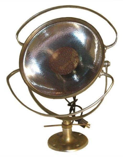 Vintage Industrial Surgical Light by Castle Lighting.  USA, circa 1920s.  Made of brass with a silver undertone; features original patina and adjustable light.