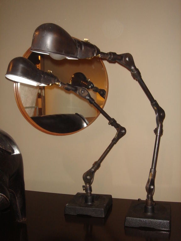 Pair of Industrial table lamps by Fostoria, USA, circa 1940.

Bold styling and fully adjustable. Fully restored and rewired. Features a black oxide finish.

Priced at $1,500 each or $2,900 per pair.

Item may be viewed at our showroom at NYDC,