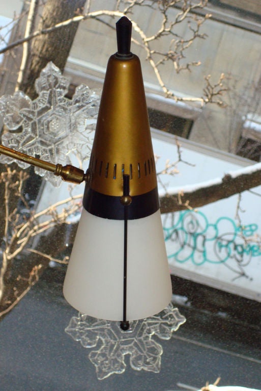 Floor to Ceiling Pole lamp with frosted glass diffusers. Each arm individually adjustable. Height adjustable to span floor to ceiling. Wiring on the exterior of the fixture allows the arms to be placed in any location on the central pole.