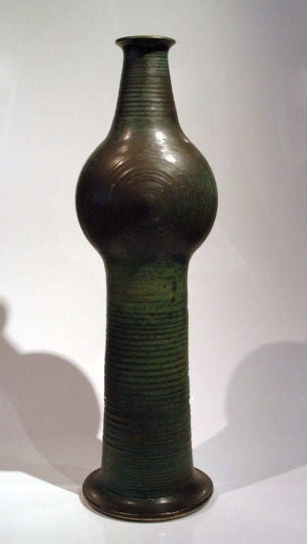 Exceptional pipe can vse by Francesca Mascitti Lindh. An early example of Lindh's work, done when she was first hired by Arabia's Art Department. Mottled green through a bronze grey ground. Signed with the incised cipher, FML; and Arabia. I have