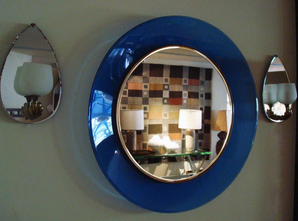 Round Mirror by Max Ingrand for Fontana Arte, Italy 1966. Beveled mirror set in a brass frame surrounded by a concave glass frame in deep blue. All original, original mirror stamped 