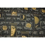 BLUE/BLACK FORNASETTI FABRIC WITH TAN FIGURES