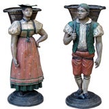 PAIR OF GERMAN PAINTED TOLE STANDING FIGURAL BOUQUETIERS
