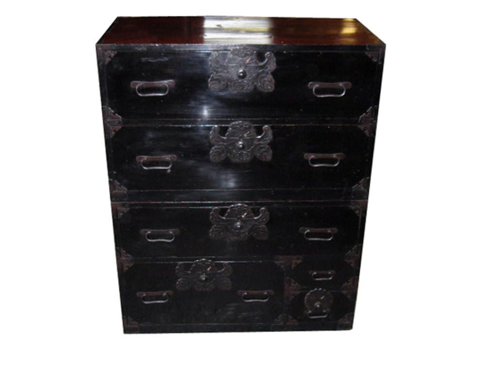 Meiji period black laquered Shonai isho dansu (clothing chest) from Tokyo.  The chest is made from Sugi (cedar) wood and the drawers are finished in original black lacquer.  The two section tansu can be separated and used as a coffee table or side