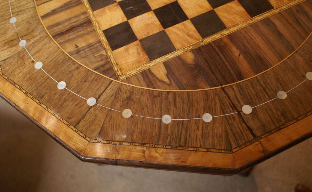 A decorative rosewood  pedestal table inlaid with mother of pearl featuring a chess board probably made in Ireland during the first half of the 19th century