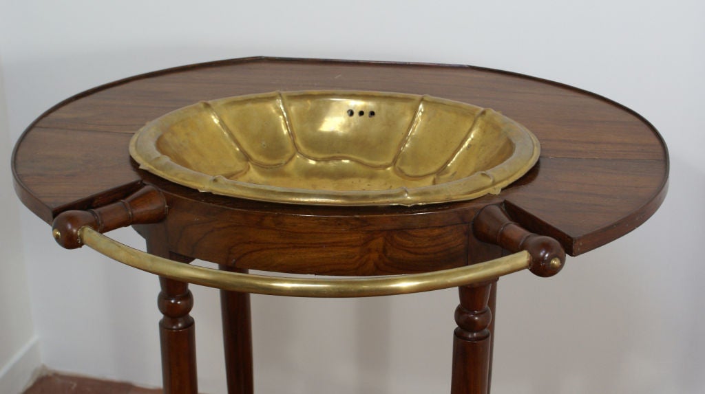 A unique vintage wash stand with brass bowl and towel rack. I have never seen anything quite like it. It was bought in France and was made, circa 1920.