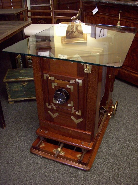 Rare and valuable, very large antique Hunter Penrose brass-bound portrait camera. We are told it is a working camera.  We think it makes a most impressive base, either for a lamp table or a dining table.  The 35