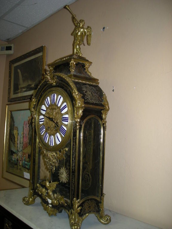 Tortoise shell appliqué with boule and bronze ormolu brass decoration. Clock strikes every hour and half hour. Mechanism is flawless and is in perfect working condition.<br />
<br />
Signed by Paris Thuret, Royal Purveyor of France