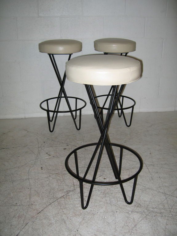 Set of three Paul Tuttle for Modern Color iron and leather bar stools. New upholstery.