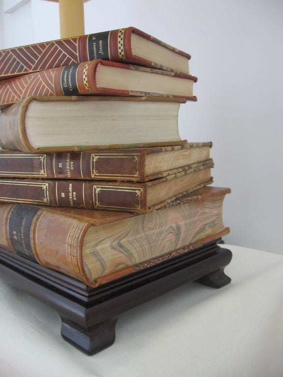Table lamp fabricated from Swedish books, mounted on wood base, with parchment shade.  Newly wired.<br />
Height to top of socket is 16