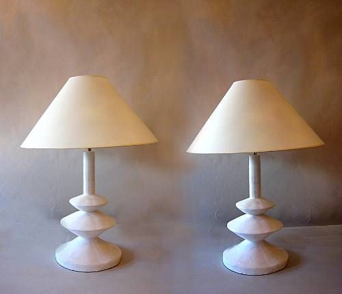 Sublime pair of French midcentury plaster table lamps by Jacques Grange designed for Yves Saint Laurent Boutiques in France during the 1970s. Grange's inspiration was a model by Giacometti from the 1930s made for Jean-Michel Frank. The lamps