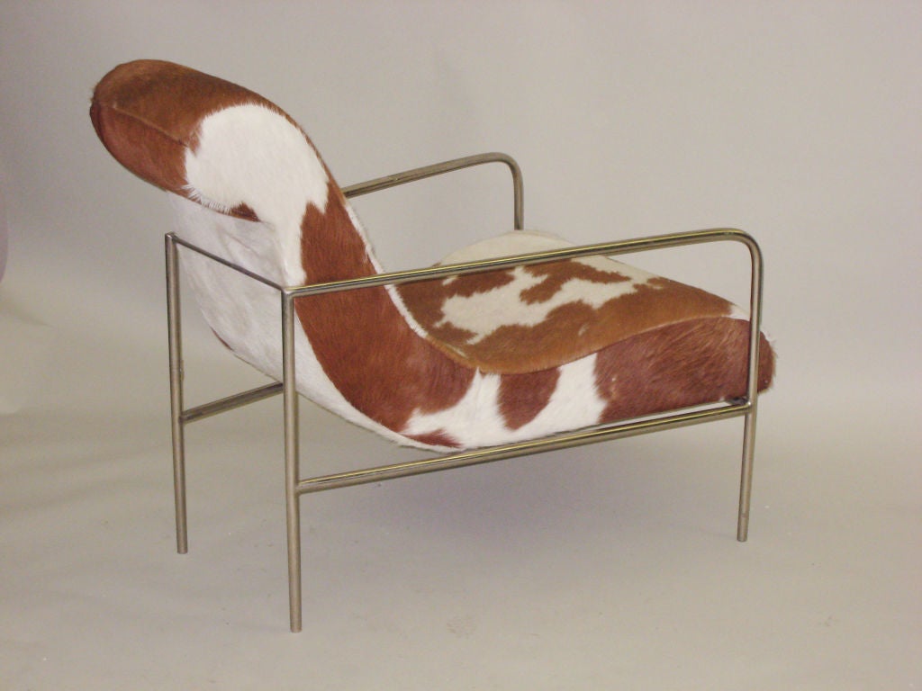 1 Rare Lounge / Club Chair with Cowhide Upholstery in the Manner of the Early French Modernist, Rene Herbst. Possibly produced by Les Élablissements Siegel et Stockman Reunis, France. 

Sold Individually.

Bibliography: 