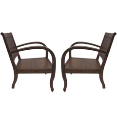Deux paires de fauteuils coloniaux français du milieu du siècle dernier