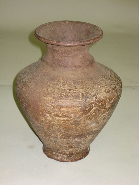 A classicly formed antique Khmer pottery vase/Amphora from the Khmer region of South East Asia. 

A sober form that provides a complement to a Mid-Century or modern environment.
