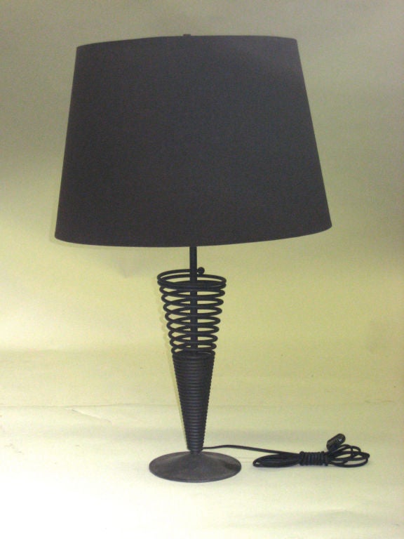 A Pair of Coil Form Table Lamps in Black Enameled Metal.