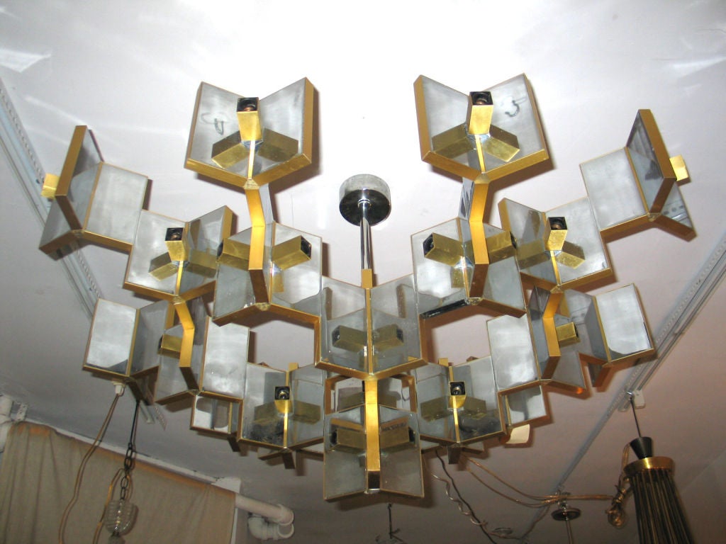 A Large (Width) Modernist Chandelier Composed of Reflective Metal Panels Arranged in a Geometric Pattern with 39 Lights by Sciolari. Width is 60