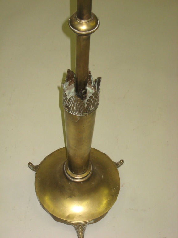 An elegant French Art Deco standing lamp in solid brass influenced by the Empire tradition. Base diameter is approximately 14