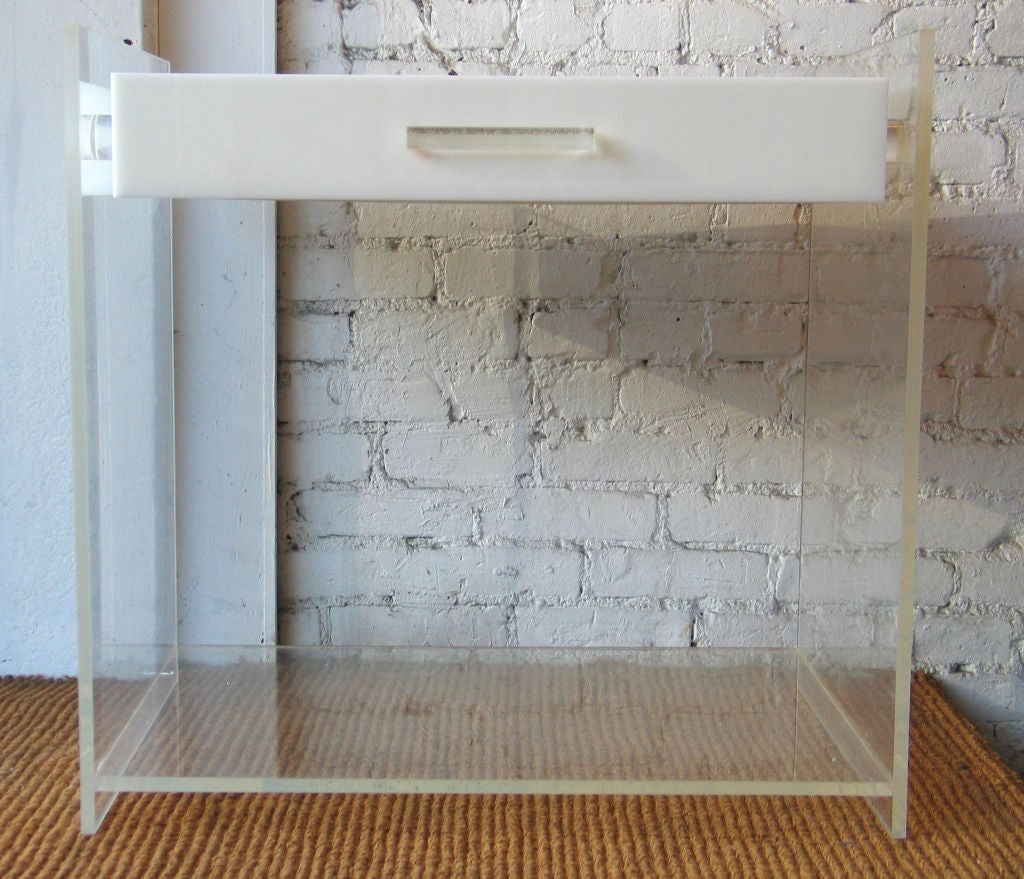 A Chic Pair of Modernist End Tables / Nightstands in Lucite with Drawers  in Solid White Plastic. The Drawers are Suspended via Clear Lucite Nubs to Give the Impression of Floating.