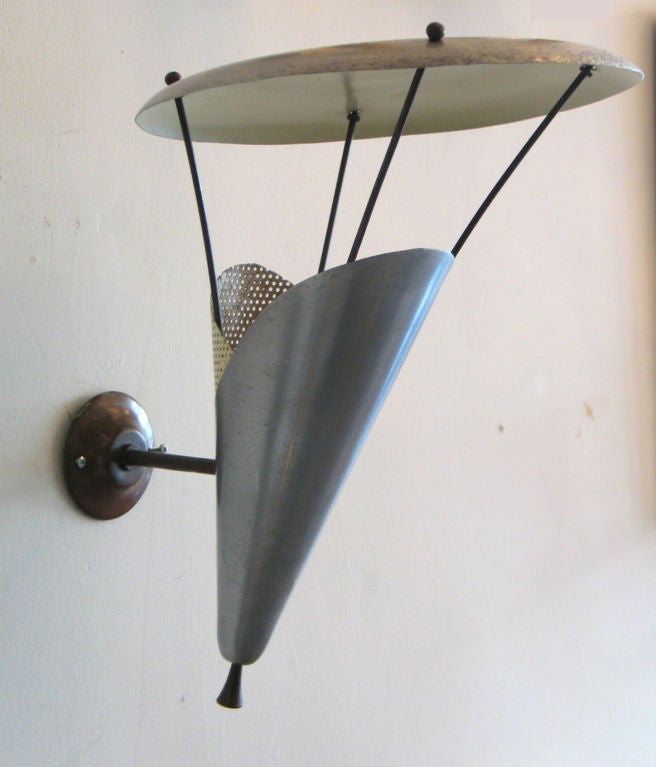 Rare Pair of French Mid-Century Modern metal wall lights by Jacques Biny.

Similar to model 134 B by Jacques Biny
 Lacquered metal and brass details.
Luminalite edition
France, c. 1950
H. 37 cm, L. 34 cm, P. 35 cm