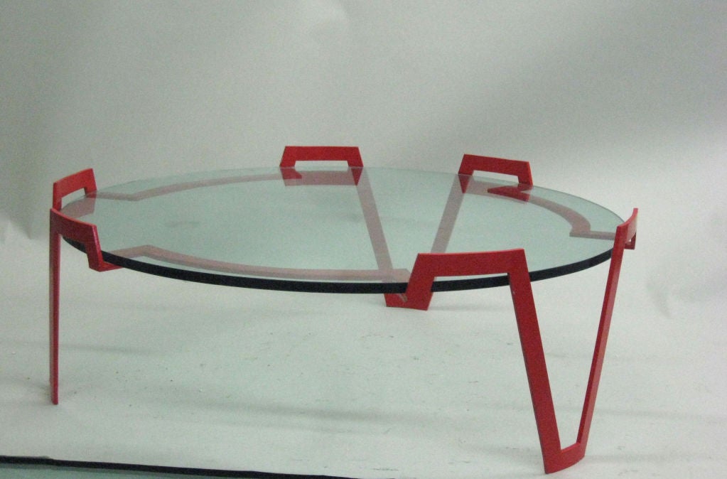 A stunning French Mid-Century Modern style coffee table base in red lacquered wrought iron. 

Literature: Similar model is published in Jean Royère by Pierre Emmanuel Martin-Vivier, Editions Norma, Paris, 2002, p. 214.