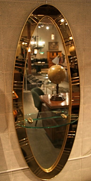Beautiful Amber smoked glass with brass accents and shelf. Perfect for your entry and what an entry it makes.