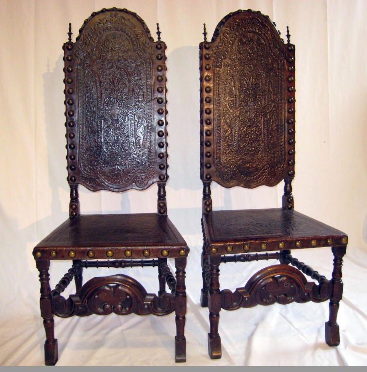 Ornately tooled leather and carved wood chairs.  The date is 1840 to be exact.