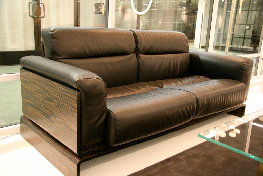 Well-crafted the yacht of sofas. Beautiful Macassar ebony and black Leather. Lead time 10-12 weeks.