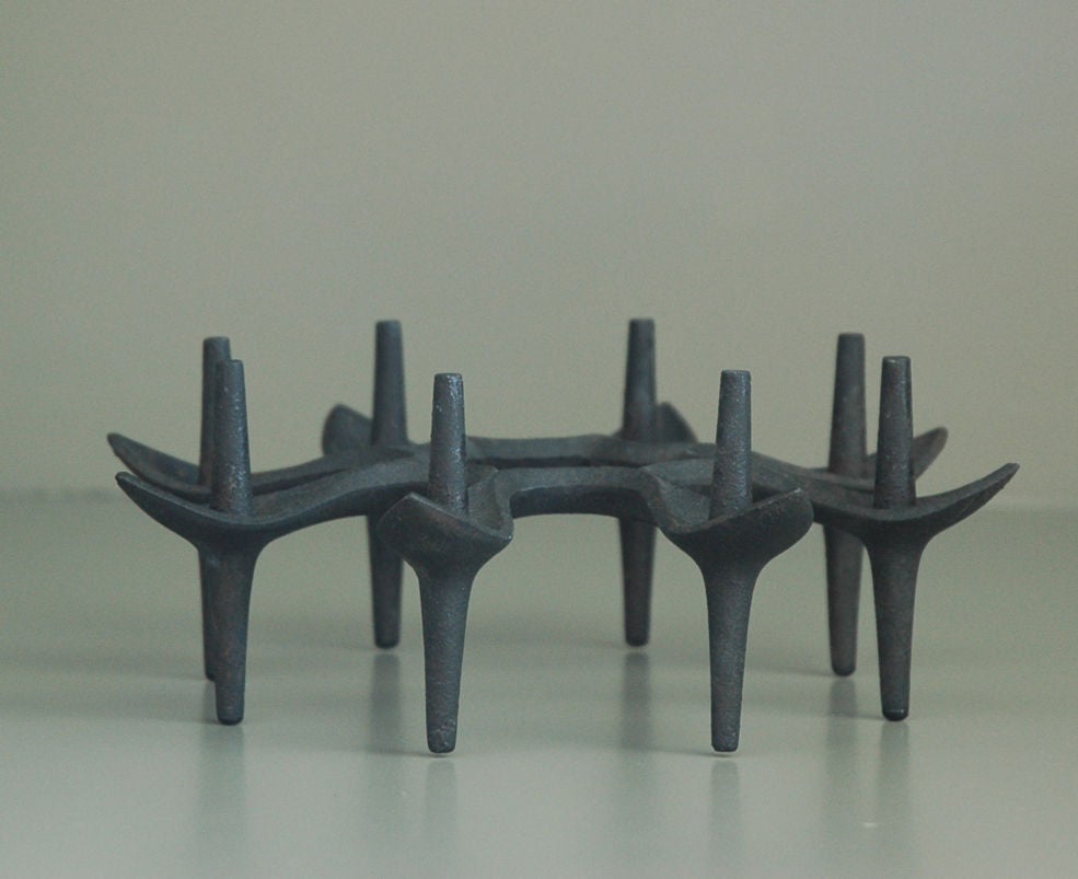 Black iron candleholder with a floral motif by Jens Quistgaard for Dansk.
