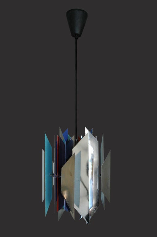 Pair of pendants with geometric panels made of chrome and enameled metal. Wired for US junction boxes. Each pendant takes one E27 75w maximum bulb. Overall drop can be adjusted. Priced and sold individually