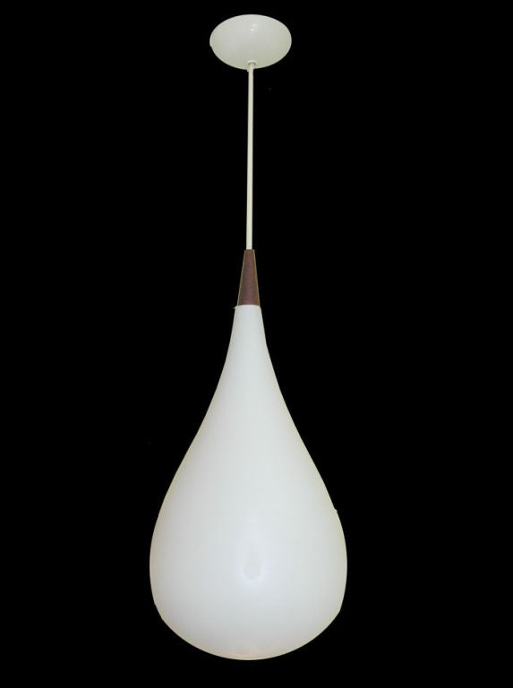 Teak and satin glass pendant light.