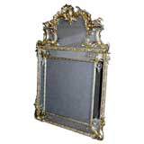 French 19th century gilt mirror with crested top