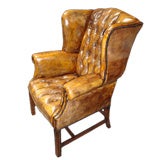 Pair of custom Chesterfield tufted wing-back chairs