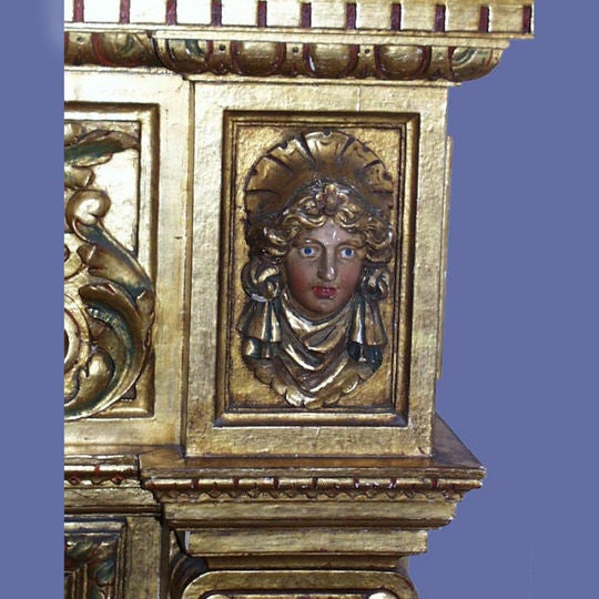 Magnificent Italian 19th century carved, gilt and polychrome mantel with carved faces.<br />
FOR MORE INFORMATION, PLEASE VISIT WWW.CONNOISSEURANTIQUES.COM