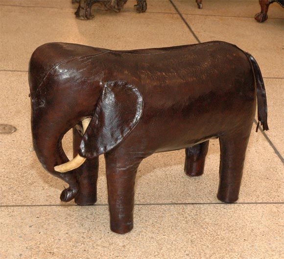 Dark brown leather elephant with ivory leather tusks