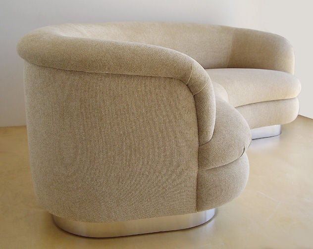 Heavy custom 1970s curved sofa. The base is polished steel. Newly upholstered with soft chenille. Top quality custom construction.