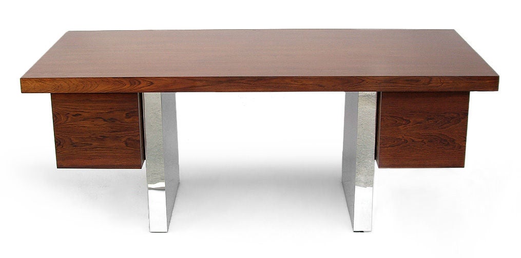 Five drawer rosewood and polished chrome desk. Designed by Roger Sprunger for Dunbar Furniture Company, Berne, Indiana.