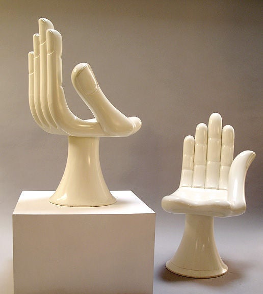 Pair of carved wood hand chairs with original white painted finish. Each chair is signed inside of base.