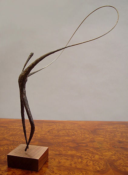 Bronze sculpture on wood base by San Diego artist Jack Boyd.