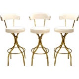 Three 1970s Brass Upholstered Bar Stools